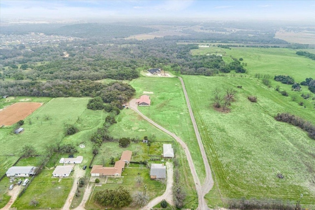 birds eye view of property featuring a rural view