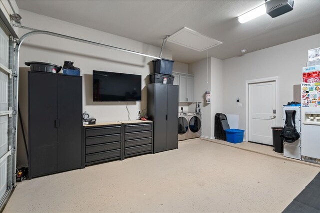 garage featuring a garage door opener and washer and clothes dryer