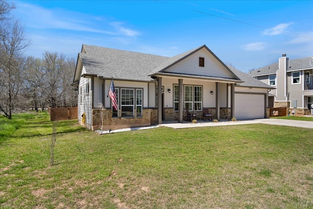 view of front of home featuring a front yard, fence, a shingled roof, concrete driveway, and a garage