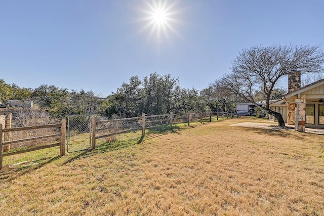 view of yard featuring a gate and fence