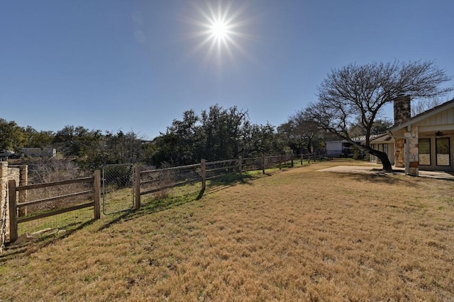 view of yard with a gate and fence