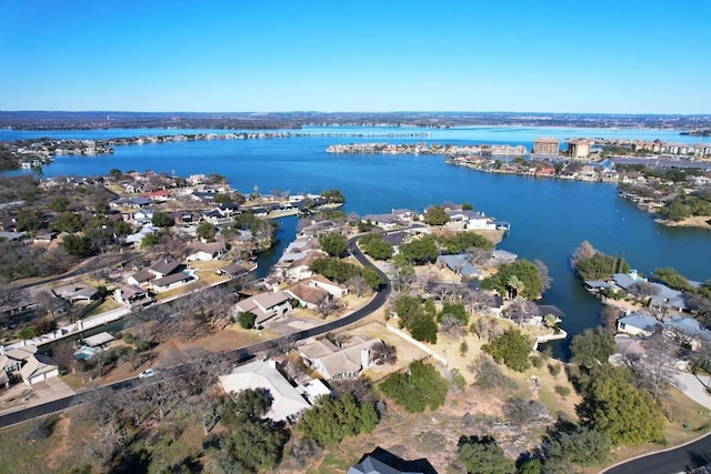 107 Boot Hl, Horseshoe Bay, TX 78657 - aerial view of property and surrounding area featuring a large body of water and nearby suburban area