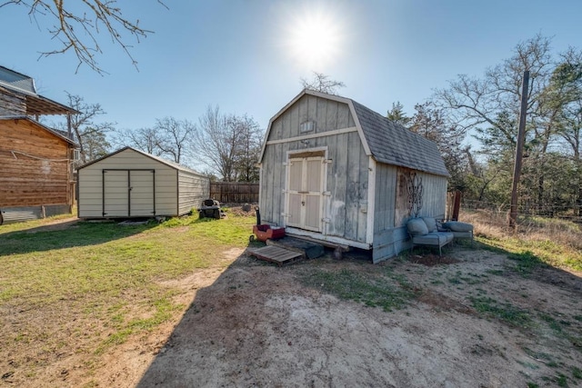 view of shed with fence