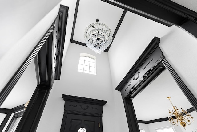 room details with a notable chandelier and ornamental molding