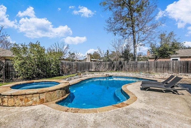 view of swimming pool with a patio, a fenced backyard, and a pool with connected hot tub