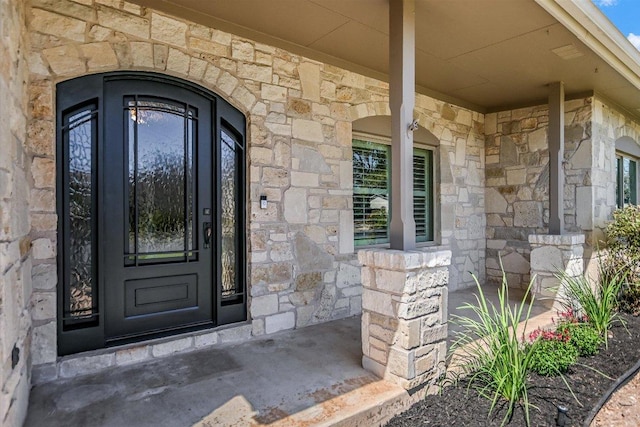 11402 Pencewood Dr, Austin, TX 78750 - doorway to property with stone siding and covered porch