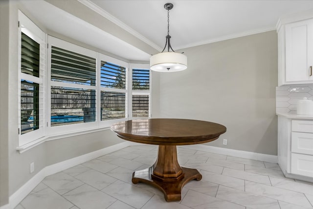 dining area featuring baseboards, marble finish floor, and ornamental molding