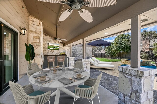 11402 Pencewood Dr, Austin, TX 78750 - fenced backyard featuring ceiling fan, a patio, outdoor dining space, and a pool with connected hot tub