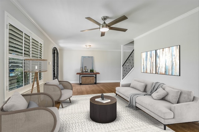 11402 Pencewood Dr, Austin, TX 78750 - living room with crown molding, ceiling fan, wood finished floors, and stairway