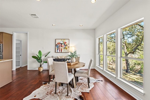 dining area featuring dark wood finished floors, visible vents, recessed lighting, and baseboards