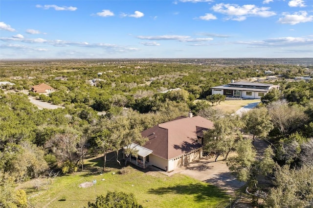 bird's eye view featuring a forest view