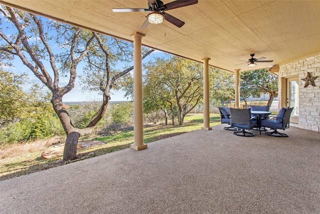 view of patio featuring outdoor dining area and a ceiling fan