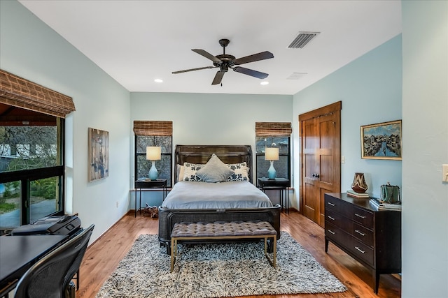 bedroom with wood finished floors, baseboards, visible vents, recessed lighting, and ceiling fan