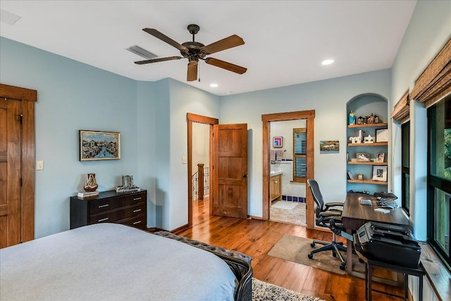 bedroom featuring visible vents, ceiling fan, recessed lighting, wood finished floors, and ensuite bath