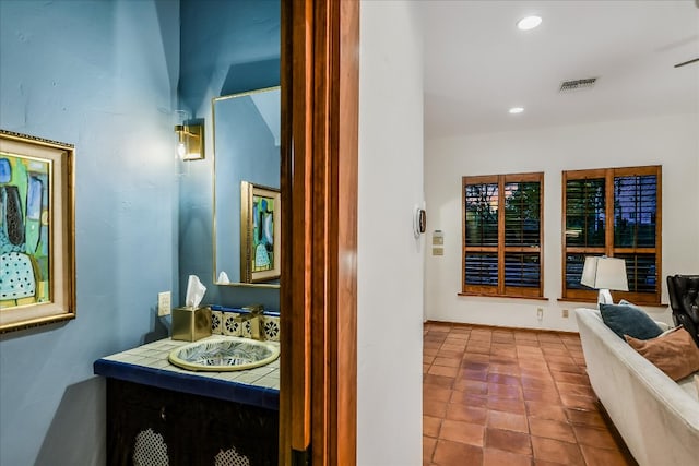 bathroom featuring vanity, recessed lighting, and visible vents