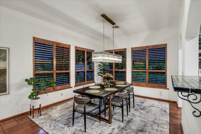 dining area featuring baseboards