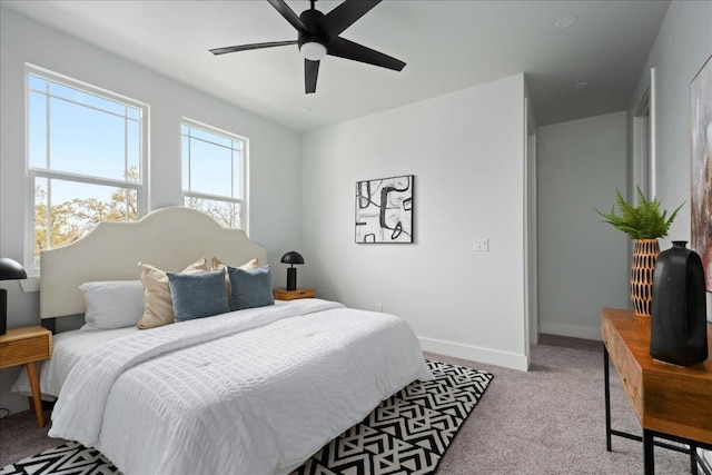 bedroom featuring carpet, baseboards, and ceiling fan