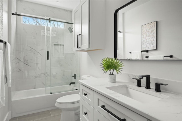 full bath featuring vanity, toilet, and enclosed tub / shower combo