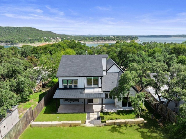 aerial view with a view of trees and a water view