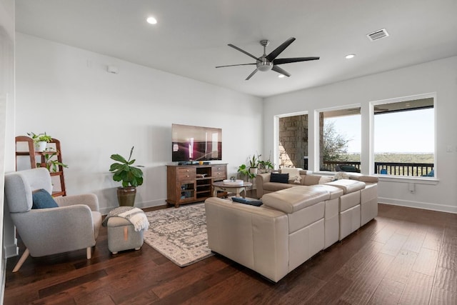 living area with dark wood finished floors, recessed lighting, visible vents, and baseboards