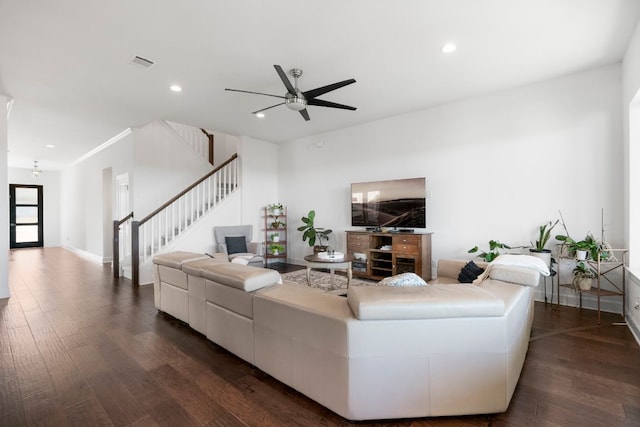 living room featuring stairway, recessed lighting, visible vents, and dark wood-style flooring