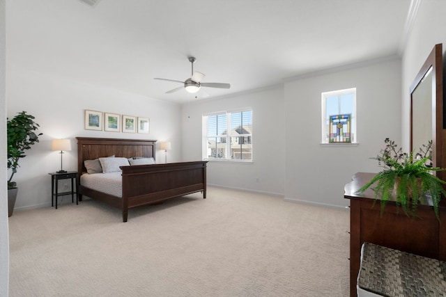 bedroom featuring ornamental molding, a ceiling fan, baseboards, and light carpet