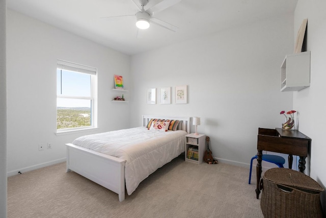 bedroom with baseboards, light carpet, and a ceiling fan