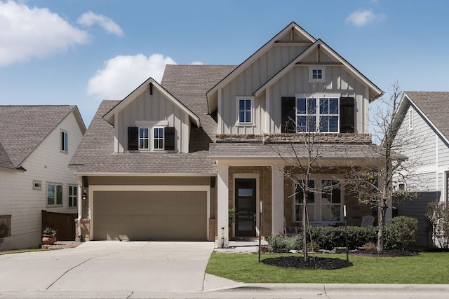 craftsman-style home with a garage, roof with shingles, board and batten siding, and concrete driveway