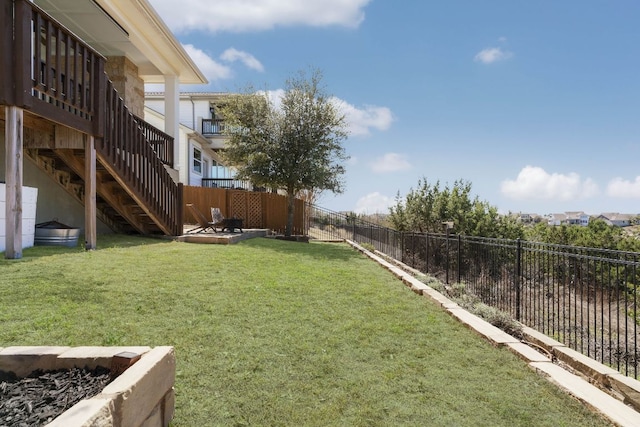 view of yard with stairway and a fenced backyard