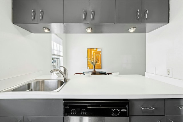 300 Crockett St Unit 118, Austin, TX 78704 - kitchen featuring gray cabinetry, stainless steel dishwasher, a sink, and light countertops
