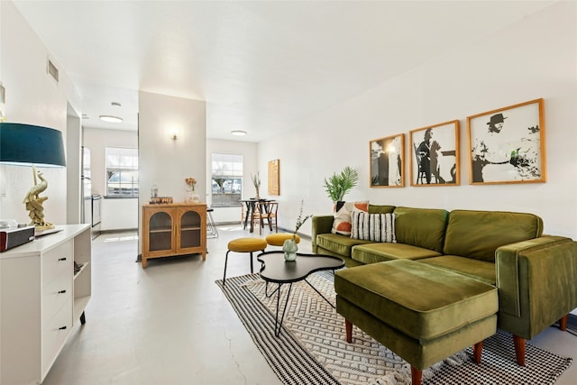 living room with visible vents and concrete floors