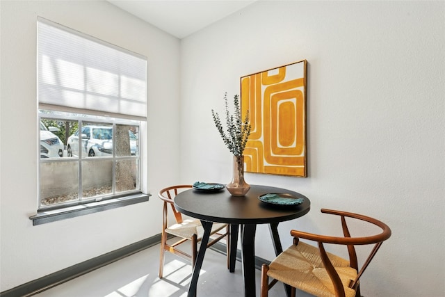 300 Crockett St Unit 118, Austin, TX 78704 - dining room with baseboards and concrete floors