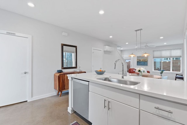 kitchen featuring dishwashing machine, recessed lighting, concrete flooring, and light countertops