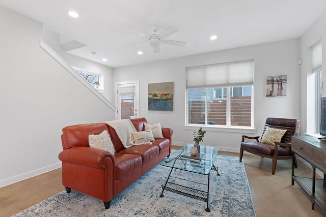 living area featuring recessed lighting, baseboards, and ceiling fan