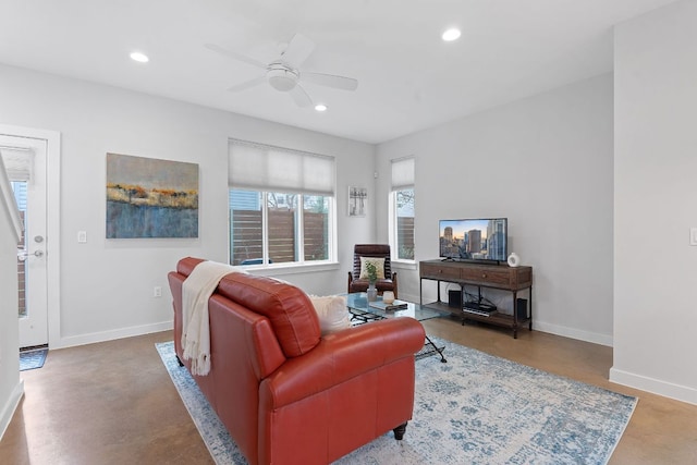 living room featuring recessed lighting, baseboards, concrete floors, and ceiling fan