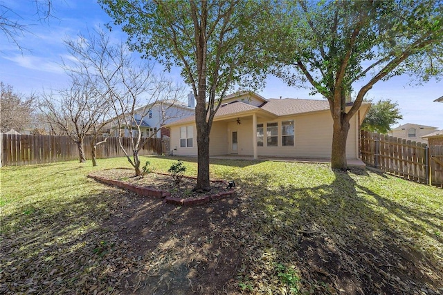 exterior space featuring a patio, a yard, and a fenced backyard