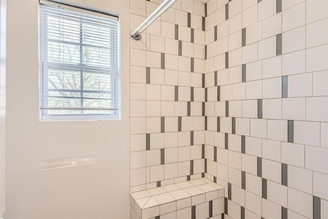 full bathroom with a tile shower