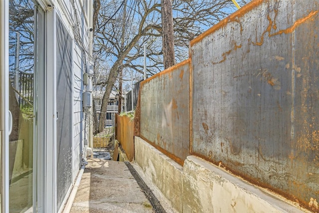 view of home's exterior with fence