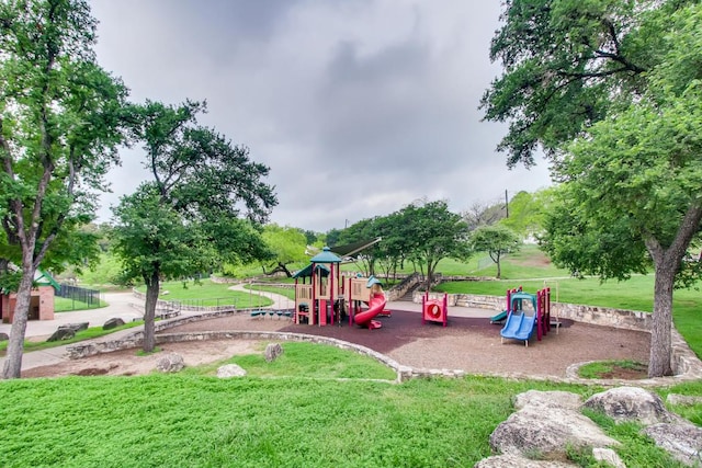 community play area featuring a lawn