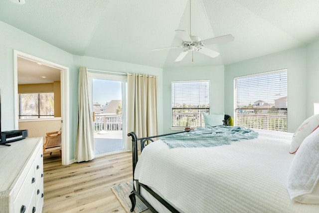 bedroom featuring a ceiling fan, light wood-style floors, and access to outside