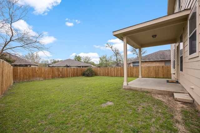 view of yard featuring a patio area and a fenced backyard