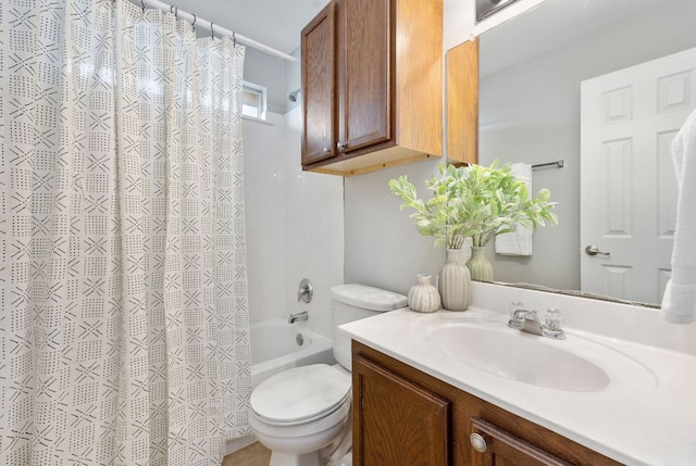 bathroom with vanity, toilet, and shower / bath combo