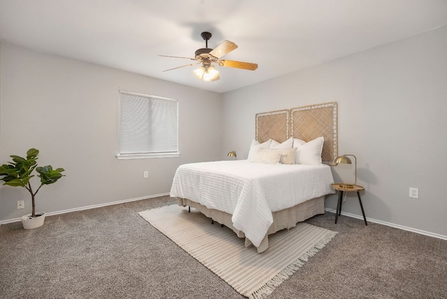 carpeted bedroom with a ceiling fan and baseboards