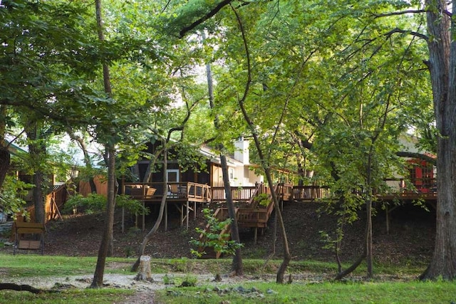 view of yard with stairway and a wooden deck