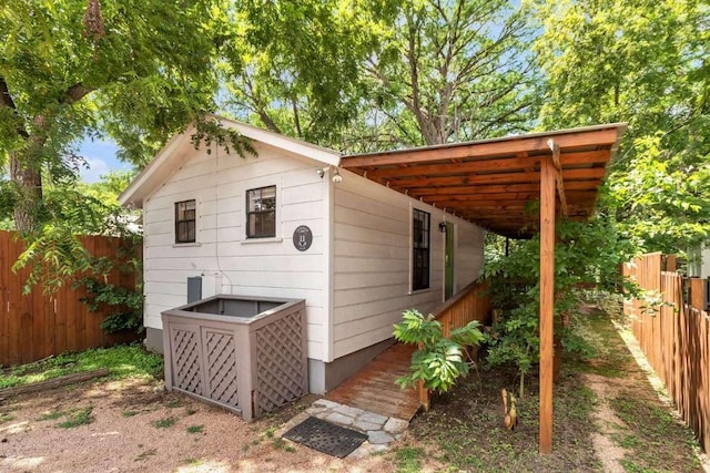 view of outdoor structure featuring a fenced backyard