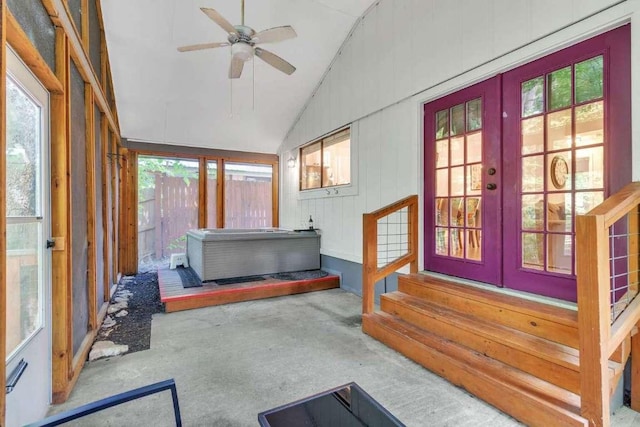 sunroom featuring lofted ceiling, french doors, a wealth of natural light, and ceiling fan