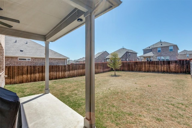 view of yard featuring a patio area and a fenced backyard