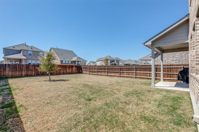 view of yard with a fenced backyard