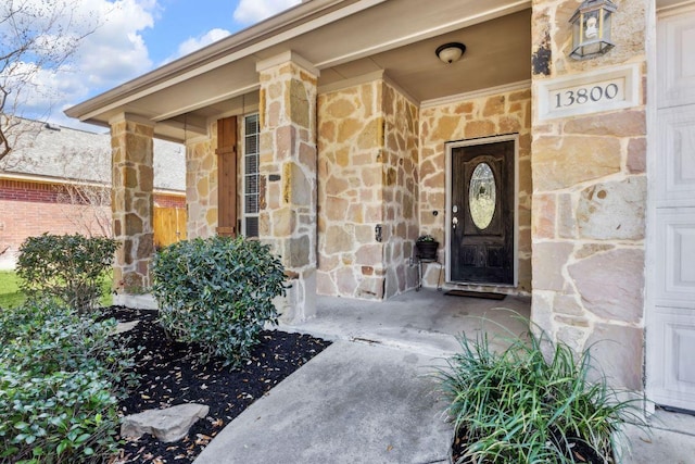 entrance to property featuring stone siding