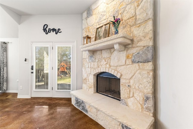 unfurnished living room featuring concrete flooring and a fireplace